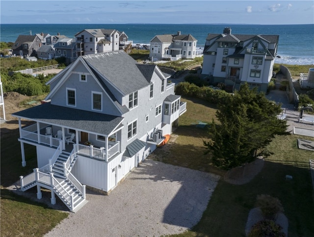 aerial view featuring a residential view and a water view