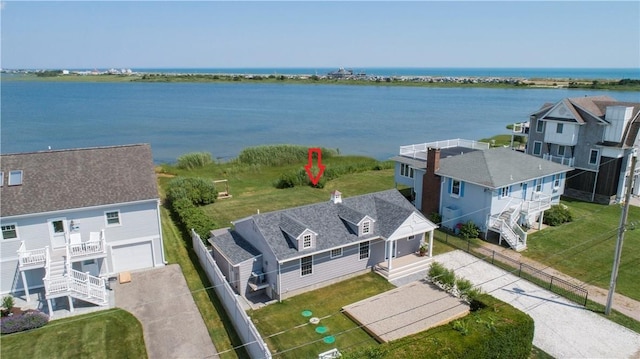 bird's eye view with a residential view and a water view