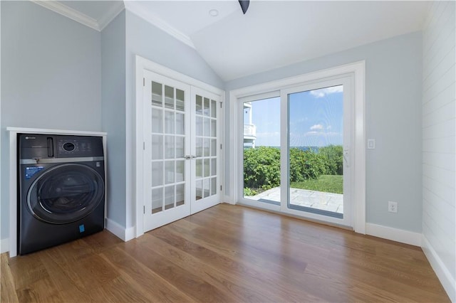 laundry area with french doors, washer / clothes dryer, baseboards, and wood finished floors