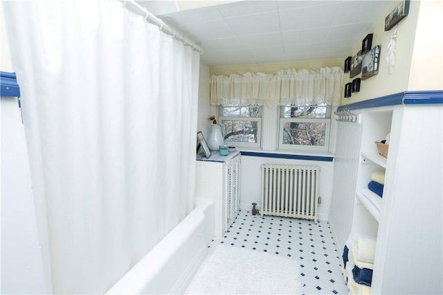 bathroom featuring tile patterned floors and radiator