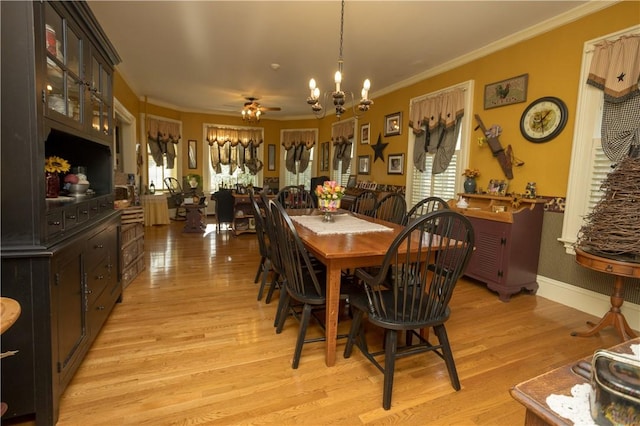 dining area with a wealth of natural light, light wood-type flooring, and ornamental molding