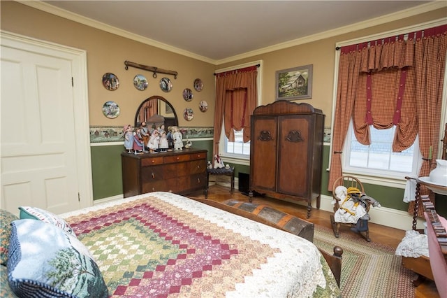 bedroom with crown molding and baseboards