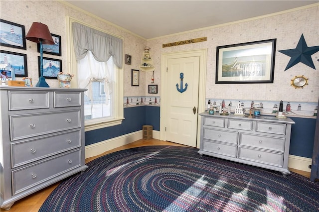 bedroom with wallpapered walls, crown molding, baseboards, and dark wood-style flooring