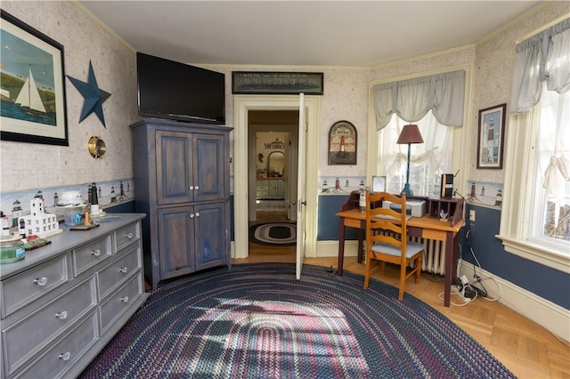 office featuring wallpapered walls, plenty of natural light, and baseboards