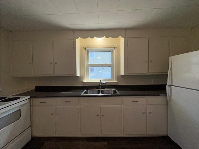 25 N Union St, Lincoln, RI 02865 - kitchen featuring white appliances, a sink, white cabinetry, and dark countertops