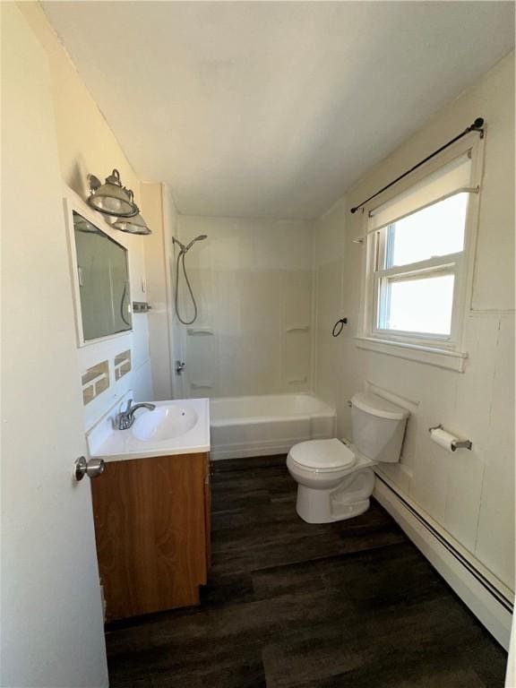 25 N Union St, Lincoln, RI 02865 - bathroom featuring baseboard heating, toilet, wood finished floors, vanity, and washtub / shower combination
