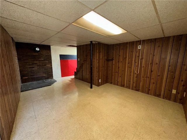 25 N Union St, Lincoln, RI 02865 - finished basement featuring a drop ceiling, tile patterned floors, and wooden walls