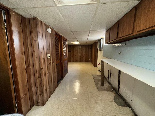 25 N Union St, Lincoln, RI 02865 - finished below grade area with light floors, a drop ceiling, wooden walls, and concrete block wall