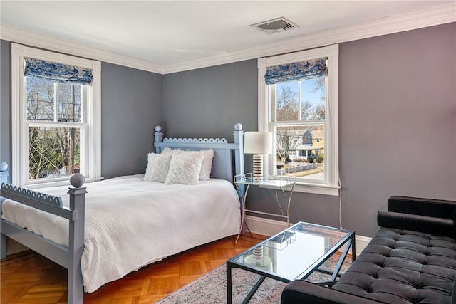 bedroom with visible vents, ornamental molding, and multiple windows