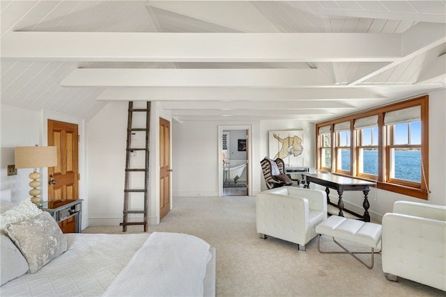 bedroom with carpet flooring, vaulted ceiling with beams, and baseboards