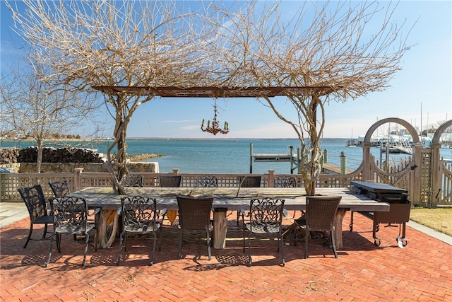 view of patio / terrace featuring outdoor dining area and a water view