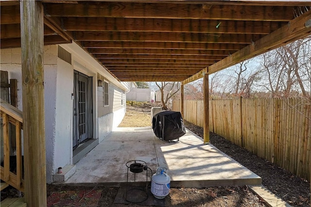 view of patio / terrace featuring a fenced backyard and a grill