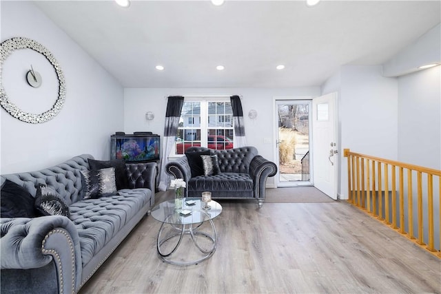 living room featuring wood finished floors and recessed lighting