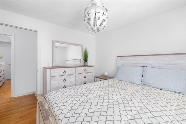 bedroom with light wood finished floors