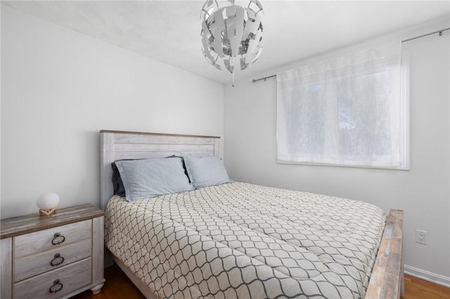 bedroom featuring wood finished floors