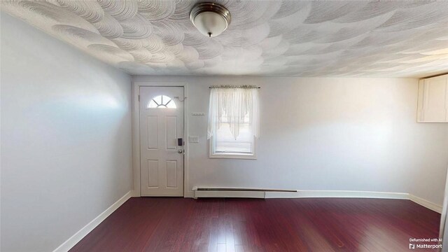66 Lancashire St, Providence, RI 02908 - foyer entrance featuring a baseboard radiator, baseboards, and dark wood-type flooring