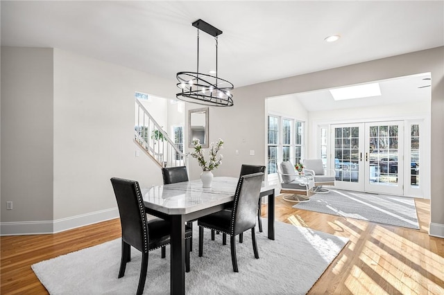 30 Lenihan Ln, East Greenwich, RI 02818 - dining area with stairs, baseboards, a chandelier, french doors, and light wood-style flooring