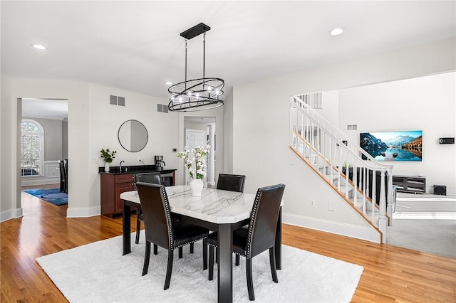 30 Lenihan Ln, East Greenwich, RI 02818 - dining space with stairs, light wood finished floors, recessed lighting, and baseboards