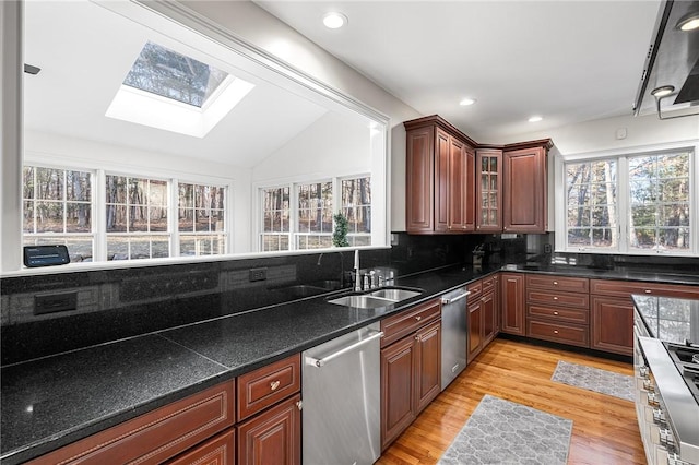30 Lenihan Ln, East Greenwich, RI 02818 - kitchen featuring stainless steel dishwasher, a sink, a skylight, healthy amount of natural light, and vaulted ceiling