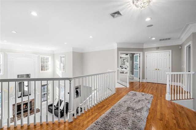 30 Lenihan Ln, East Greenwich, RI 02818 - corridor featuring an upstairs landing, wood finished floors, crown molding, and recessed lighting