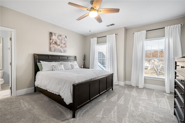 30 Lenihan Ln, East Greenwich, RI 02818 - bedroom with baseboards, light colored carpet, connected bathroom, and ceiling fan