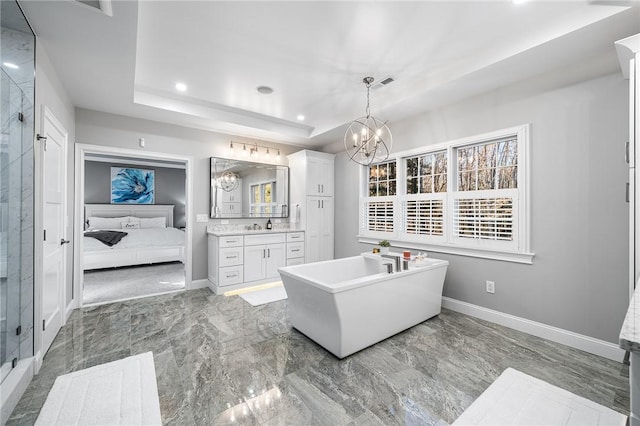 30 Lenihan Ln, East Greenwich, RI 02818 - bathroom with a shower stall, vanity, a raised ceiling, a freestanding tub, and recessed lighting