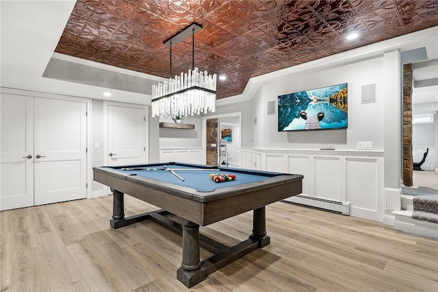 30 Lenihan Ln, East Greenwich, RI 02818 - recreation room featuring baseboard heating, an ornate ceiling, pool table, light wood-style floors, and a decorative wall