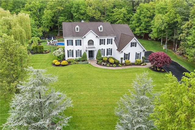 30 Lenihan Ln, East Greenwich, RI 02818 - view of front of home featuring a front lawn, a wooded view, and roof with shingles