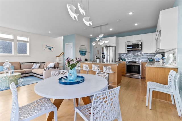 399 Atlantic Ave, Westerly, RI 02891 - dining space with light wood finished floors and recessed lighting