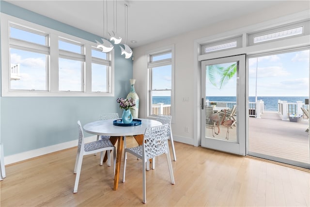 399 Atlantic Ave, Westerly, RI 02891 - dining room with light wood-type flooring and a water view