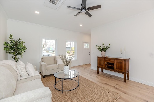 living room with recessed lighting, light wood-type flooring, a ceiling fan, and crown molding