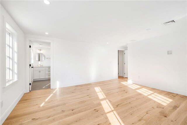 interior space with recessed lighting, visible vents, baseboards, and light wood-style floors