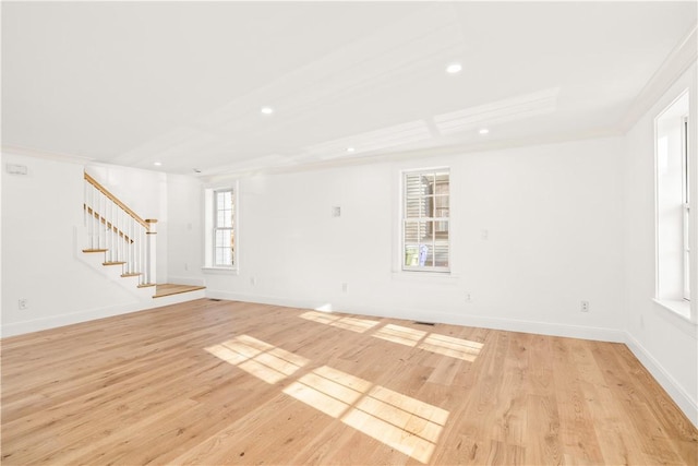 spare room featuring stairway, recessed lighting, light wood-style floors, and baseboards