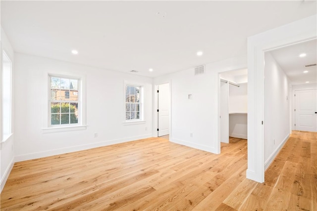 interior space with visible vents, recessed lighting, baseboards, and light wood-style floors