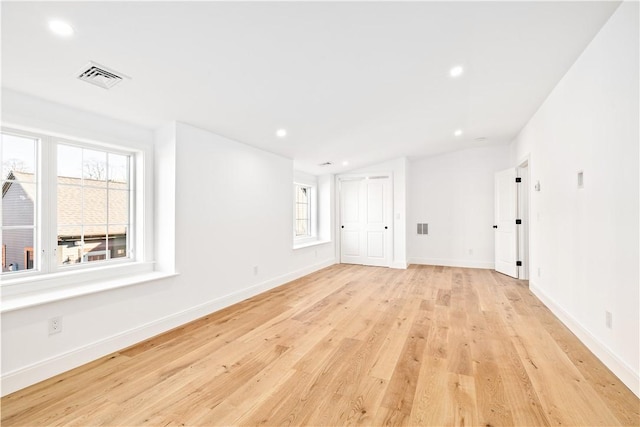 spare room featuring recessed lighting, visible vents, baseboards, and light wood-style floors