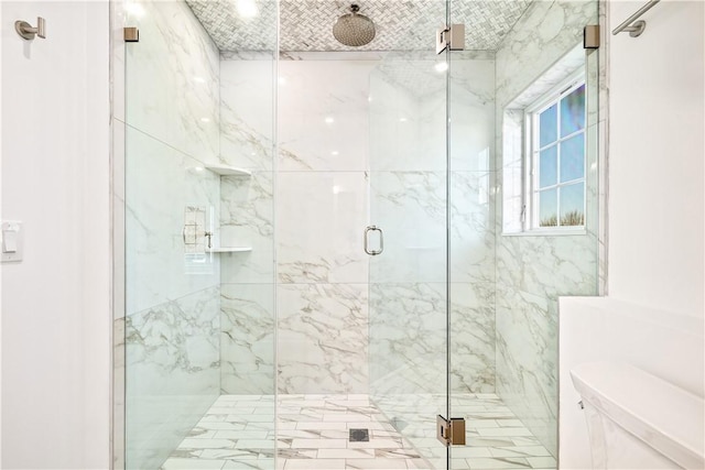 full bathroom with a marble finish shower