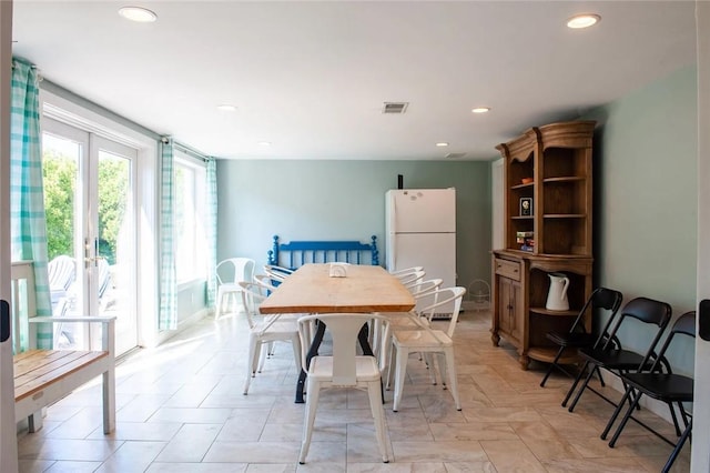 dining space featuring recessed lighting and visible vents