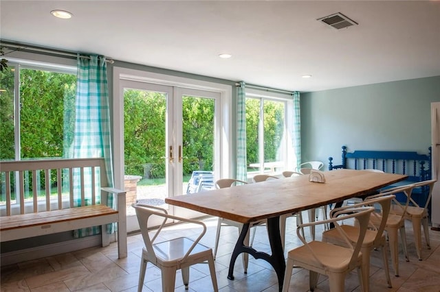 dining space with recessed lighting, visible vents, and french doors