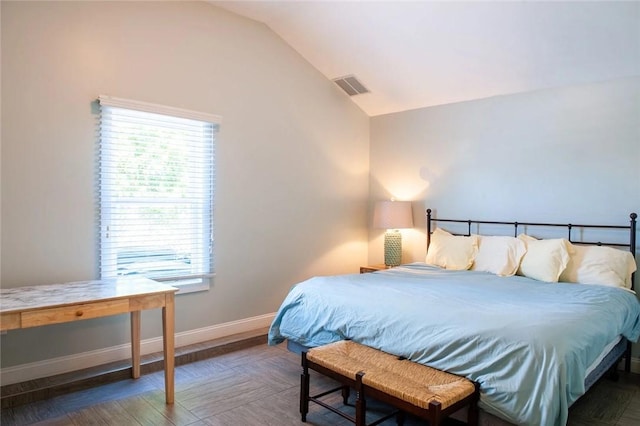 bedroom featuring visible vents, baseboards, and vaulted ceiling