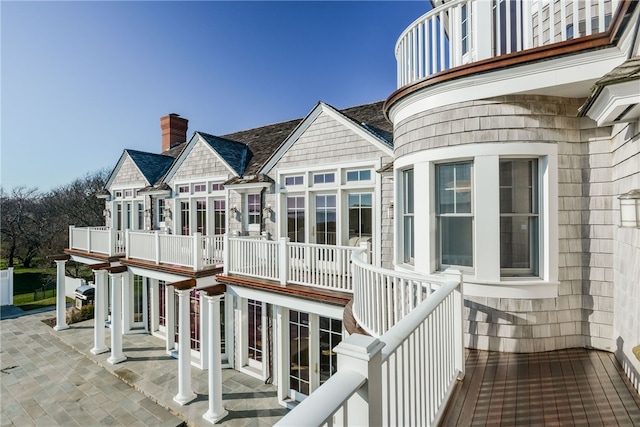 wooden terrace with a patio