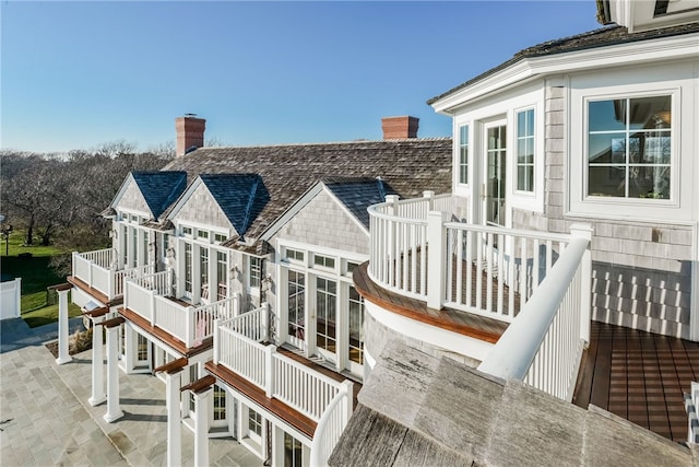 wooden terrace featuring a patio and stairway