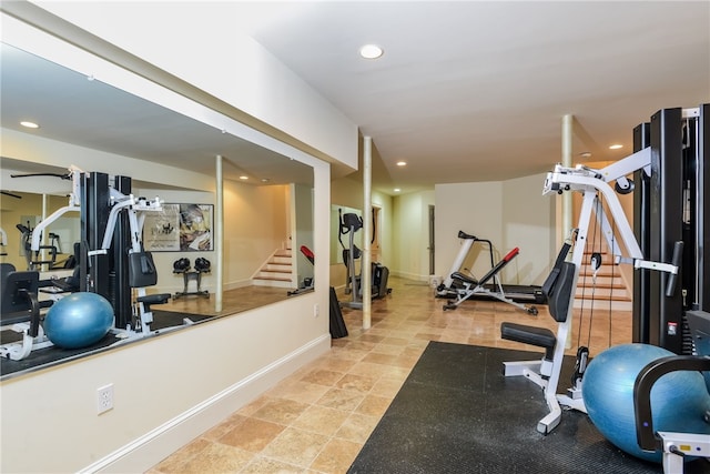 exercise room featuring baseboards and recessed lighting