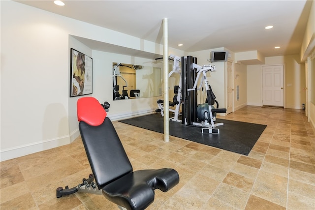 workout area featuring baseboards and recessed lighting