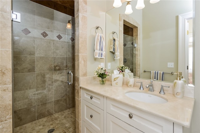 full bathroom with a shower stall and vanity