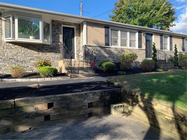 view of front of house with stone siding