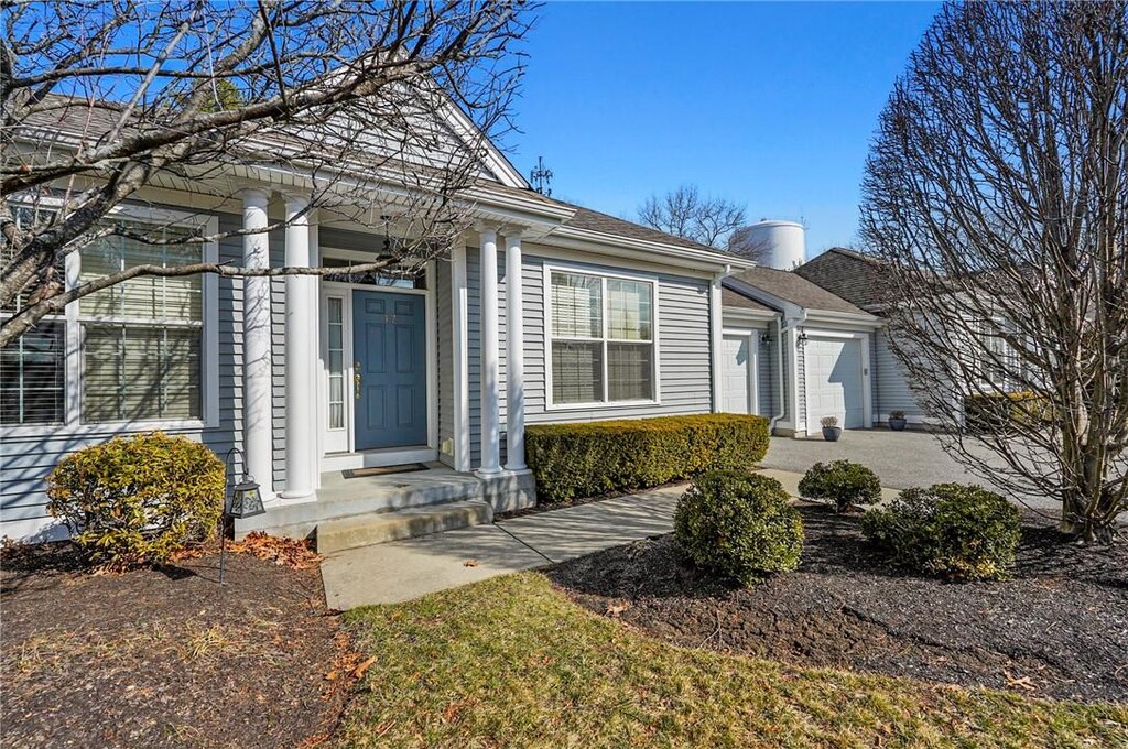 exterior space with driveway and a garage