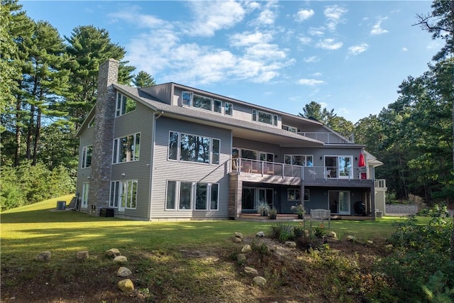 21 Fairview Ave, Hopkinton, RI 02832 - back of house with a chimney, a yard, and a balcony