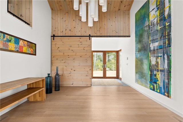 21 Fairview Ave, Hopkinton, RI 02832 - spare room with french doors, a towering ceiling, wooden ceiling, wood finished floors, and wood walls