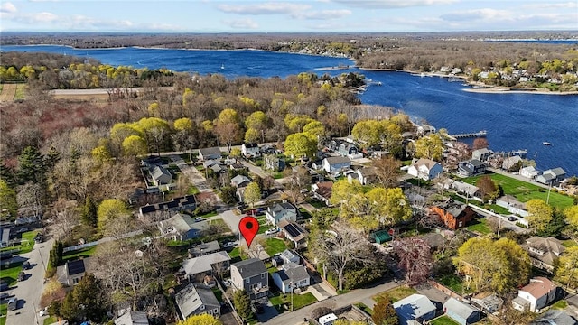 drone / aerial view with a residential view and a water view