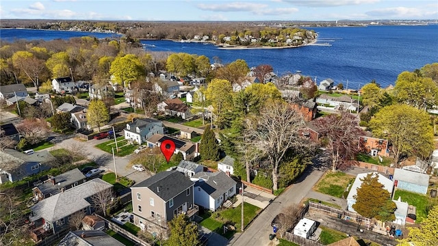 birds eye view of property with a residential view and a water view